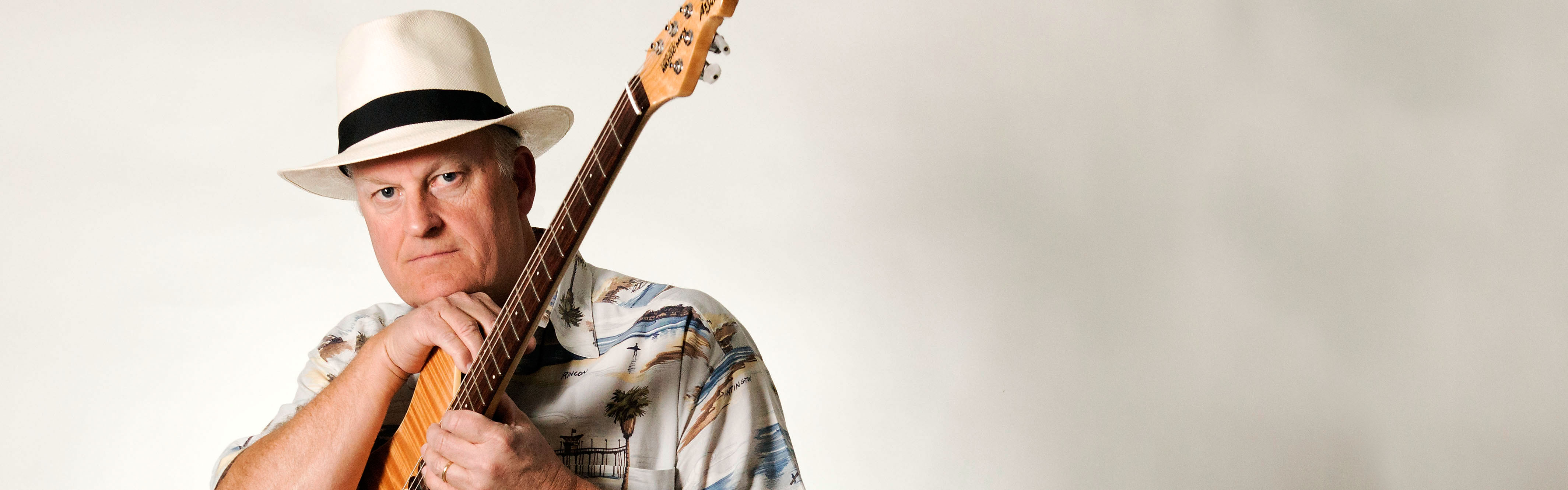 Peter Morgan with one of his Music Man Axis Sport guitar